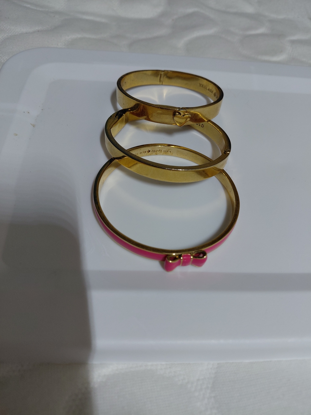 kate spade Gold Tone Stackable Bangle Set with Pink Bow Accent 3pcs
